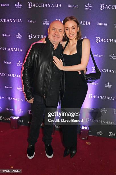 Damien Hirst and Sophie Amber attend Bacchanalia London's grand opening party on November 17, 2022 in London, England.
