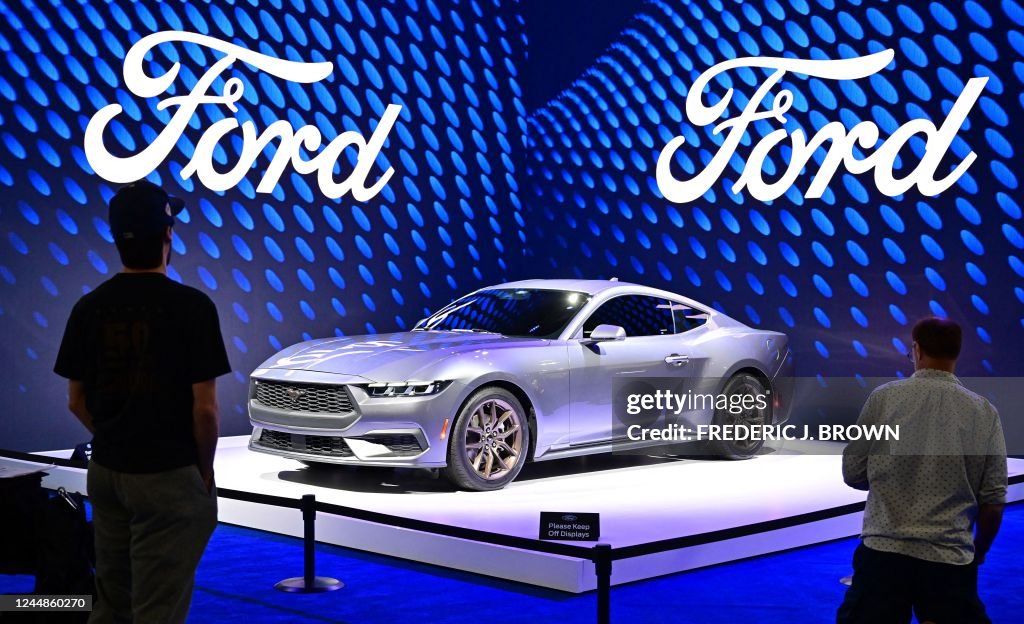 Ford Show People view the 2023 Ford Mustang on display at the 2022 Los Angeles ...