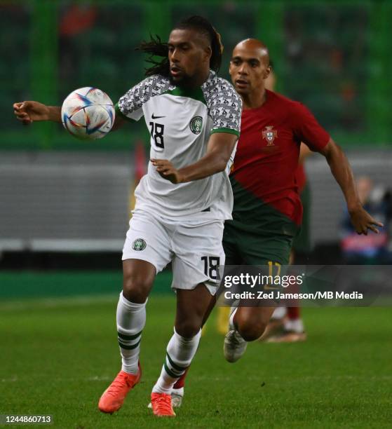 João Mario of Portugal and Alex Iwobi of Nigeria challenge for the ball during the friendly match between Portugal and Nigeria at Estadio Jose...