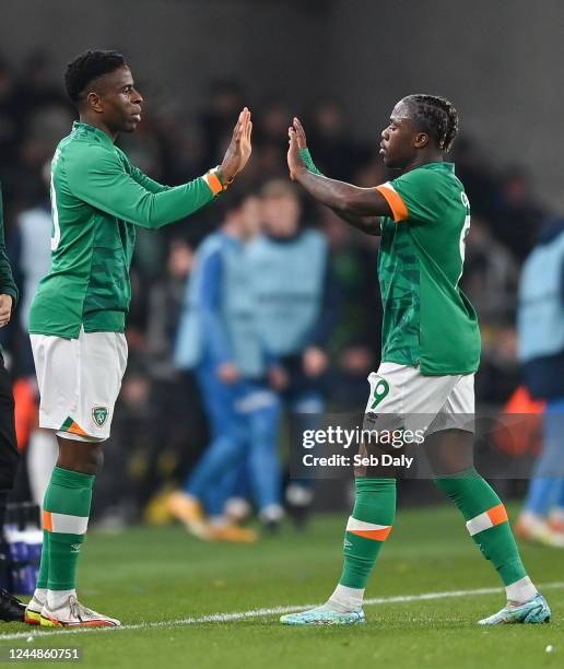 Dublin , Ireland - 17 November 2022; Michael Obafemi of Republic of Ireland, right, is replaced by Chiedozie Ogbene during the International Friendly...