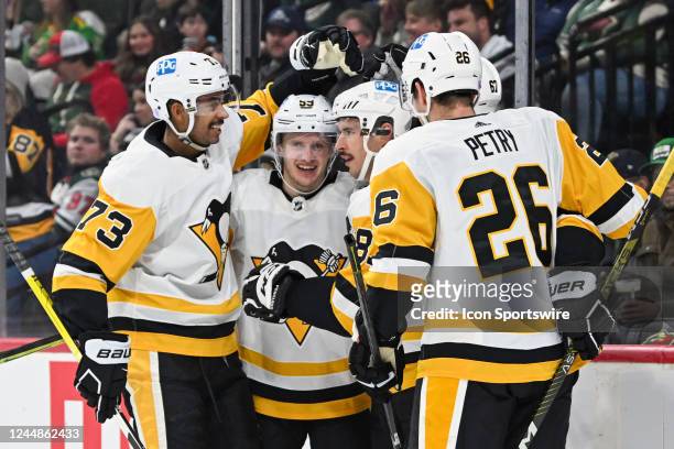 Pittsburgh Penguins Center Sidney Crosby celebrates his first period goal with teammates during a game between the Minnesota Wild and Pittsburgh...