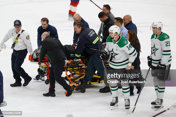 Goaltender Scott Wedgewood of the Dallas Stars is taken off the ice on a stretcher after being injured in the second period against the Florida...