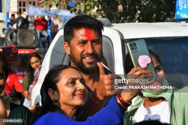 In this picture taken on November 12 former television host and Independent Party's candidate in Nepal's general election Rabi Lamichhane poses with...