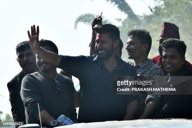 In this picture taken on November 12 former television host and Independent Party's candidate in Nepal's general election Rabi Lamichhane waves from...