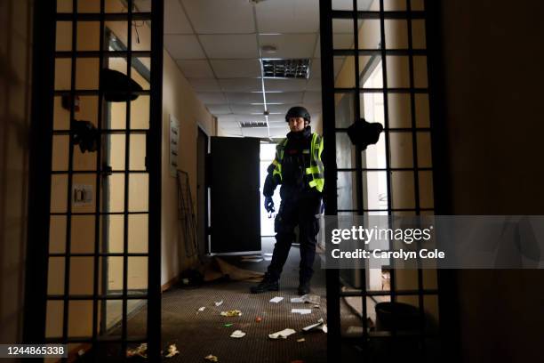 Kherson, UkraineNov. 16, 2022A Ukrainian police officer stands inside a detention center used by the Russian forces for interrogations, detentions,...