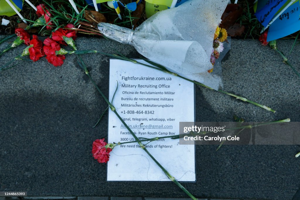 Flowers rest at a memorial to the soldiers who have lost their lives in the war against Russia near Independence Square. The note is from the "Fight for Ukriane," military recruiting office, calling for more volunteers to sign up for the effort. We need th