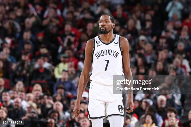 Kevin Durant of the Brooklyn Nets looks on during the game against the Portland Trail Blazers on November 17, 2022 at the Moda Center Arena in...