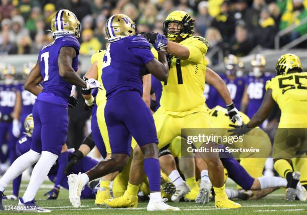 Oregon Ducks offensive lineman Malaesala Aumavae-Laulu blocks against Washington Huskies linebacker Jeremiah Martin during a PAC-12 conference...