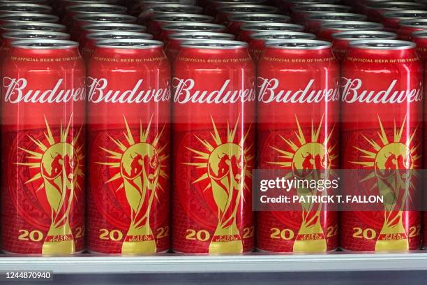 Cans of Budweiser beer featuring the FIFA World Cup logo are displayed in Doha on November 18, 2022 ahead of the Qatar 2022 World Cup football...