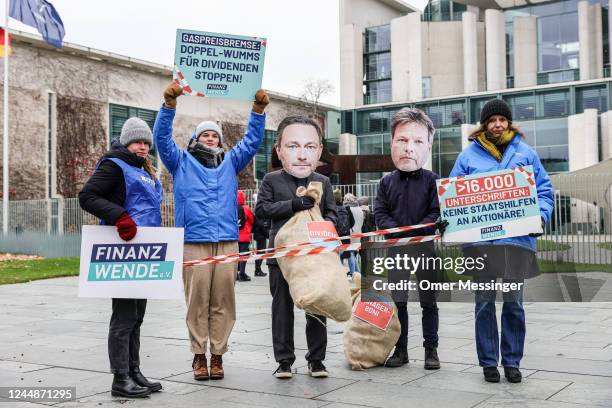 Activist protest against financial aid to companies that profit from current increased gas prices, as the weekly Government cabinet meeting takes...