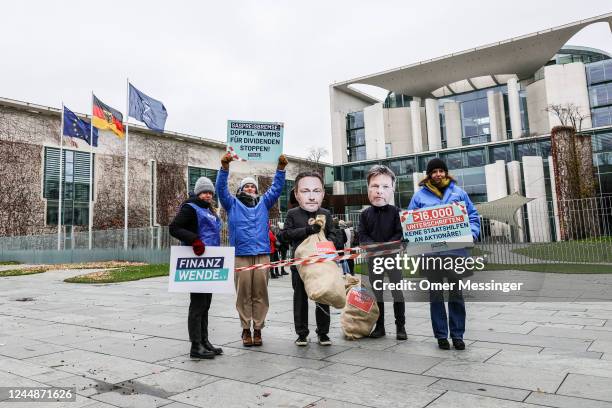 Activist protest against financial aid to companies that profit from current increased gas prices, as the weekly Government cabinet meeting takes...