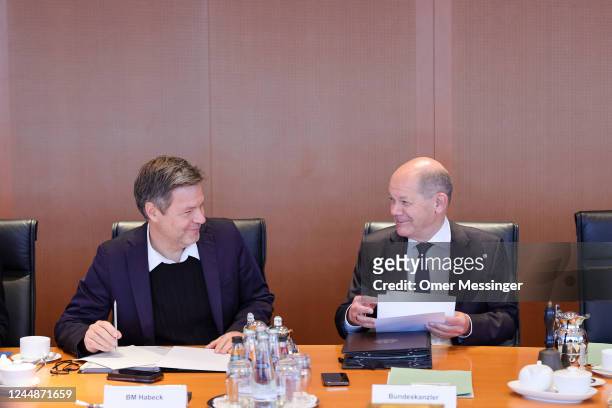 German Chancellor Olaf Scholz speaks with German Federal Minister for Economic Affairs and Climate Action, Robert Habeck before the beginning of the...