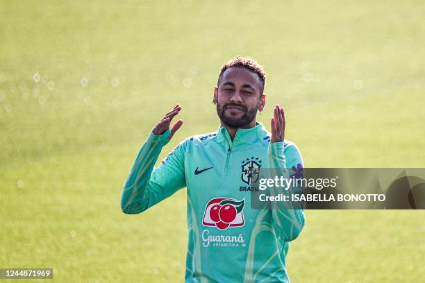 Brazil's forward Neymar reacts during a training session on November 18, 2022 at the Continassa training ground in Turin, as part of Brazil's...