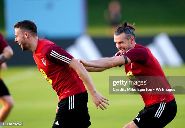 Wales' Chris Gunter and Gareth Bale during a training session at the Al Sadd Sports Club, Doha. Picture date: Friday November 18, 2022.