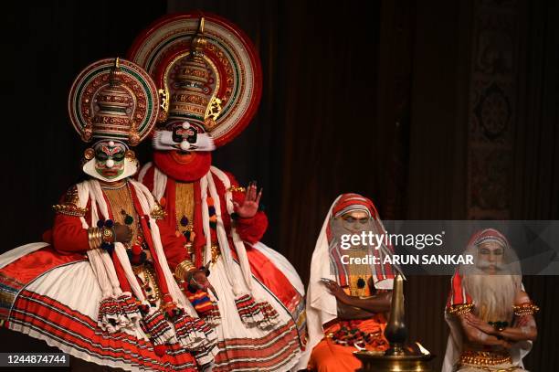 Kathakali artists, a classical dance that was created in the ancient kingdoms that now make up Kerala state, perform during a show at a cultural...