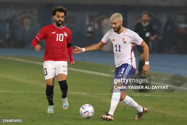 Egypt's forward Mohamed Salah and Belgium's midfielder Yannick Carrasco vie for the ball during the friendly football match between Belgium and Egypt...