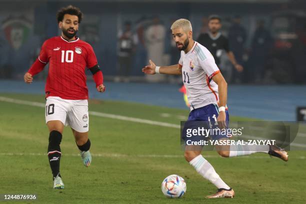 Egypt's forward Mohamed Salah and Belgium's midfielder Yannick Carrasco vie for the ball during the friendly football match between Belgium and Egypt...