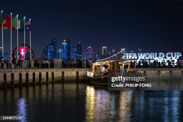 This long exposure picture shows the World Cup countdown clock and FIFA Would Cup sign from Corniche promenade in Doha on November 18 ahead of the...