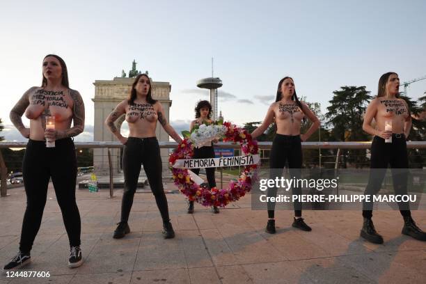 Members of the feminist activist group Femen stage a performance to draw attention on the women victims of the Franco era in front of the Arco de la...