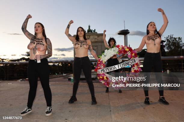 Members of the feminist activist group Femen stage a performance to draw attention on the women victims of the Franco era in front of the Arco de la...
