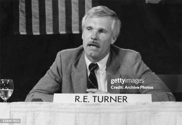 American media mogul Ted Turner at a meeting, circa 1980.