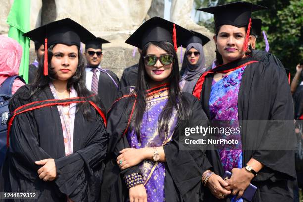 Group of graduates expressing their delight in front of the sculpture Raju at TSC area, on the 53th convocation of the students of Dhaka University...