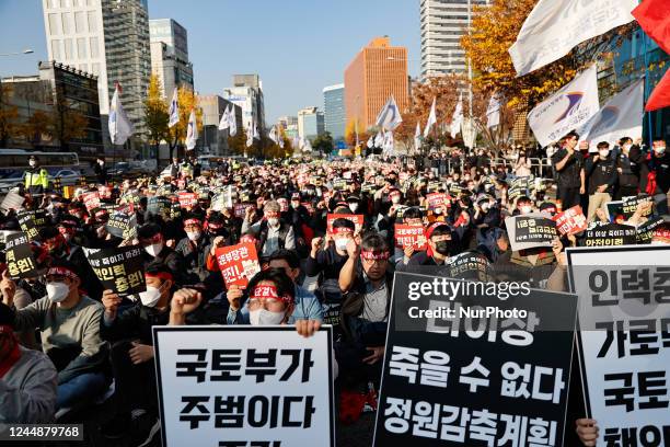 Hundreds of The Korean Confederation of Trade Unions Railroad Workers' Union members shout slogans during a rally to declare a general strike held...