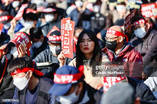 Hundreds of The Korean Confederation of Trade Unions Railroad Workers' Union members shout slogans during a rally to declare a general strike held...