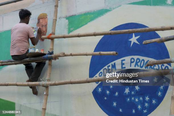 An artist paints a mural of Brazilian footballer Neymar at Gopal Nagar ahead of Qatar Football World Cup 2022 on November 18, 2022 in Kolkata, India.