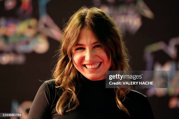 French singer, music composer and actress Izia Higelin poses upon her arrival to attend the 24th edition of the NRJ Music Awards ceremony at the...