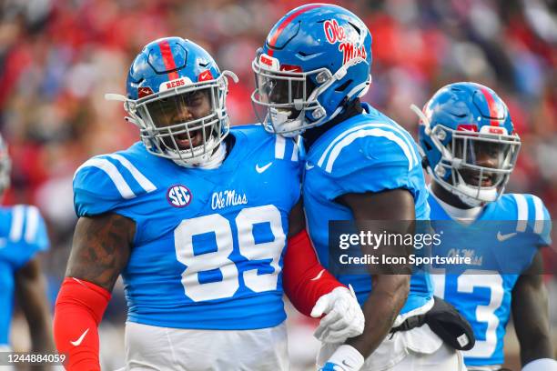 Mississippi Rebels defensive tackle JJ Pegues celebrates with linebacker Austin Keys after a sack during the first quarter of a college football game...