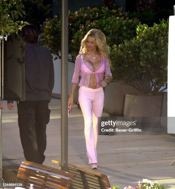 Marcus Schenkenberg and Pamela Anderson are seen on the set of "VIP" on November 08, 2000 in Los Angeles, California.