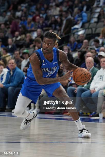 Reggie Bullock of the Dallas Mavericks dribbles the ball during the game against the Denver Nuggets on November 18, 2022 at the American Airlines...