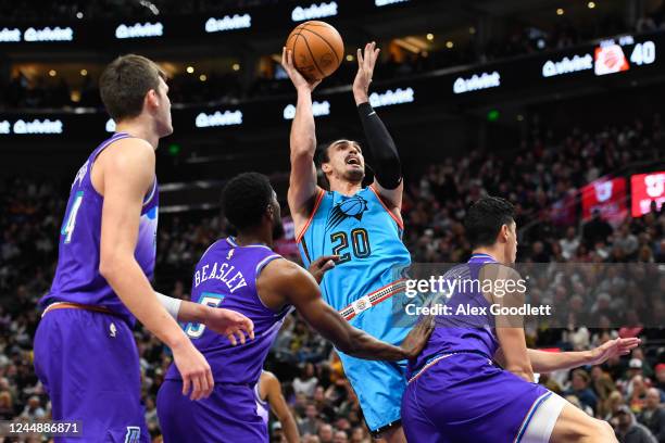 Dario Saric of the Phoenix Suns shoots over Malik Beasley and Simone Fontecchio of the Utah Jazz during a game at Vivint Arena on November 18, 2022...