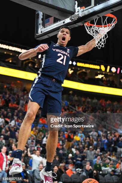 Virginia Cavaliers forward Kadin Shedrick celebrates after dunking the ball during the Continental Tire Main Event tournament college basketball game...
