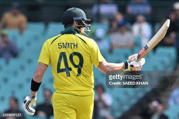 Australia's Steve Smith celebrates reaching his half century during the second one-day international cricket match between Australia and England at...