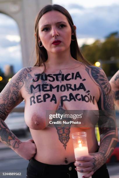 This image contains nudity) FEMEN activists shout slogans in support of victims of Franco two days ahead of Franco's death anniversary next to...