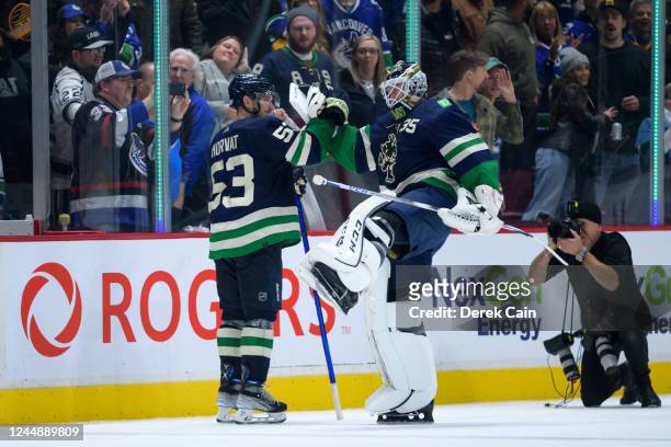 Bo Horvat and Thatcher Demko of the Vancouver Canucks celebrate after their NHL game against the Los Angeles Kings at Rogers Arena on November 18,...