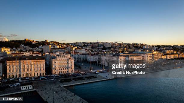 Aerial view at sunset of the Piazza Unità d'Italia , the main square of Trieste, Italy, on November 18, 2022. The square faces the Adriatic Sea, and...