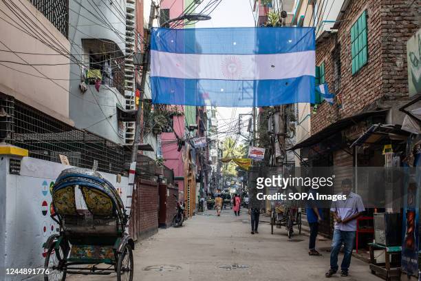 The Argentina flag, one of the participating countries in the upcoming FIFA World cup 2022 hangs in an alley in Dhaka.