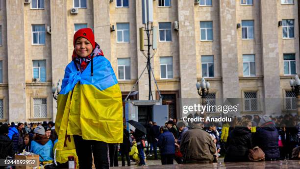 Boy is seen with a Ukrainian flag at the Svobody Square - Freedom Square as people gather to celebrate the liberation following Russiaâs withdrawal...