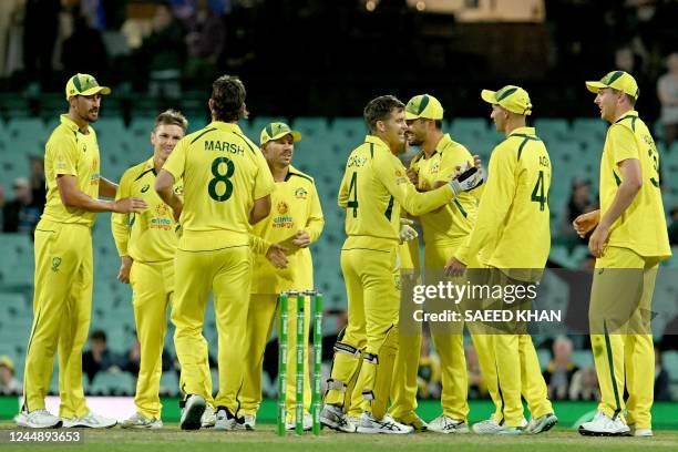 Australia players celebrate their win during the second one-day international cricket match between Australia and England at the Sydney Cricket...