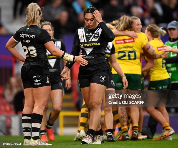 New Zealand players react after conceding a sixth try during the Rugby League World Cup Women's final between Australia and New Zealand at Old...