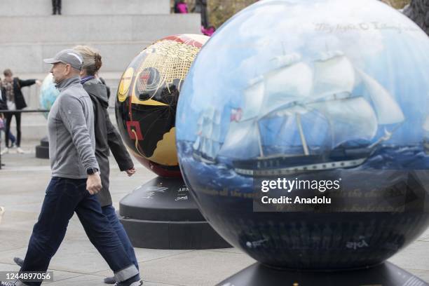 Large spherical sculptures are on display as part of the open-air exhibition "The World Reimagined" in Trafalgar Square, on November 19, 2022 in...