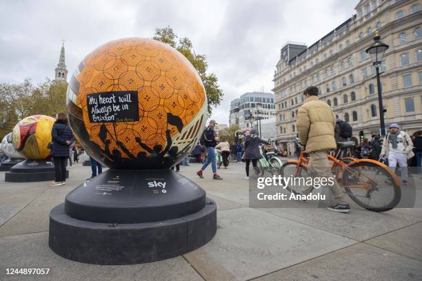 Large spherical sculptures are on display as part of the open-air exhibition "The World Reimagined" in Trafalgar Square, on November 19, 2022 in...