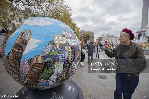 Large spherical sculptures are on display as part of the open-air exhibition "The World Reimagined" in Trafalgar Square, on November 19, 2022 in...