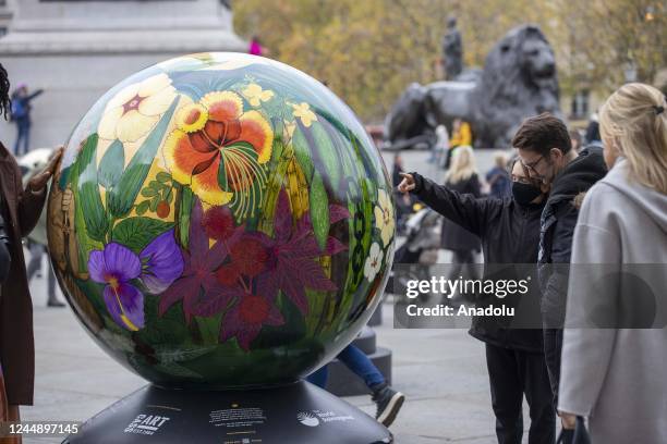 Large spherical sculptures are on display as part of the open-air exhibition "The World Reimagined" in Trafalgar Square, on November 19, 2022 in...