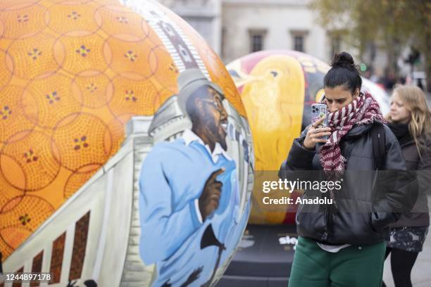 Large spherical sculptures are on display as part of the open-air exhibition "The World Reimagined" in Trafalgar Square, on November 19, 2022 in...