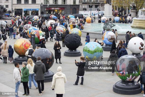 Large spherical sculptures are on display as part of the open-air exhibition "The World Reimagined" in Trafalgar Square, on November 19, 2022 in...