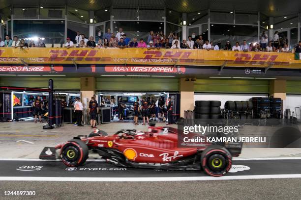 Ferrari's Monegasque driver Charles Leclerc is pits during the qualifying session on the eve of the Abu Dhabi Formula One Grand Prix at the Yas...